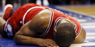 Mar 21, 2017; Toronto, Ontario, CAN; Chicago Bulls forward Cristiano Felicio (6) lies on the court after falling after a shot against the Toronto Raptors at the Air Canada Centre. Toronto defeated Chicago 122-120 in overtime. Mandatory Credit: John E. Sokolowski-USA TODAY Sports